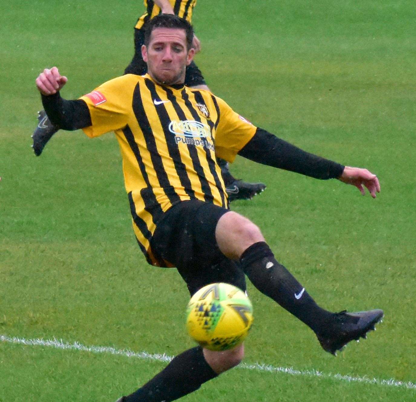 Folkestone's Ian Draycott puts a challenge in against a Gloucester City man in the FA Cup on Saturday. Picture: Randolph File