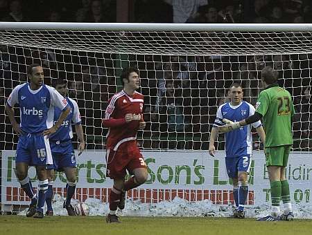 Gills keeper Alan Julian turns to blame his defenders after Scott Cuthbert had made it 2-0 to Swindon. Picture: Barry Goodwin