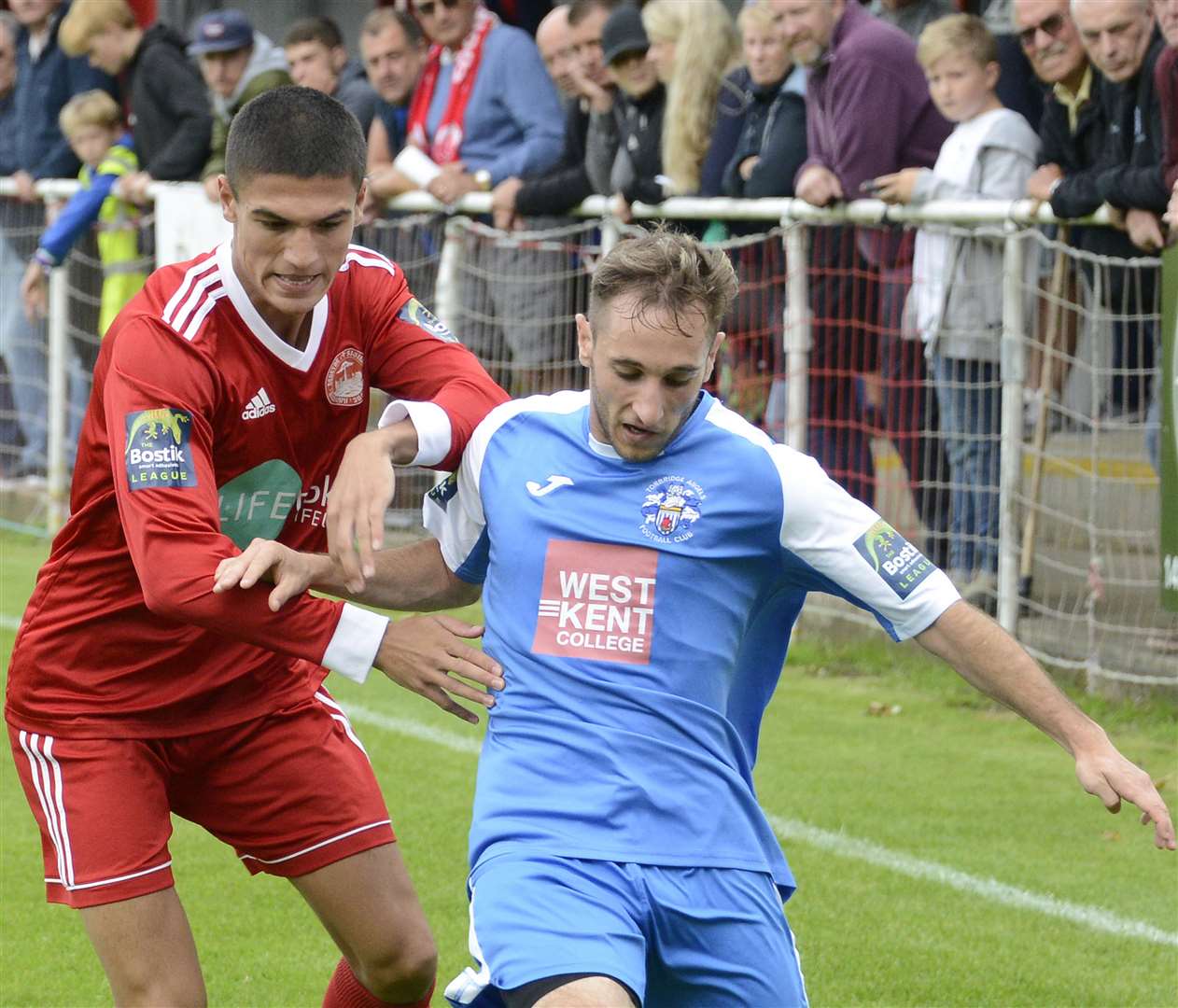 Euan Sahadow during his Hythe days up against Adem Ramadan who was then playing for Tonbridge. Picture: Paul Amos