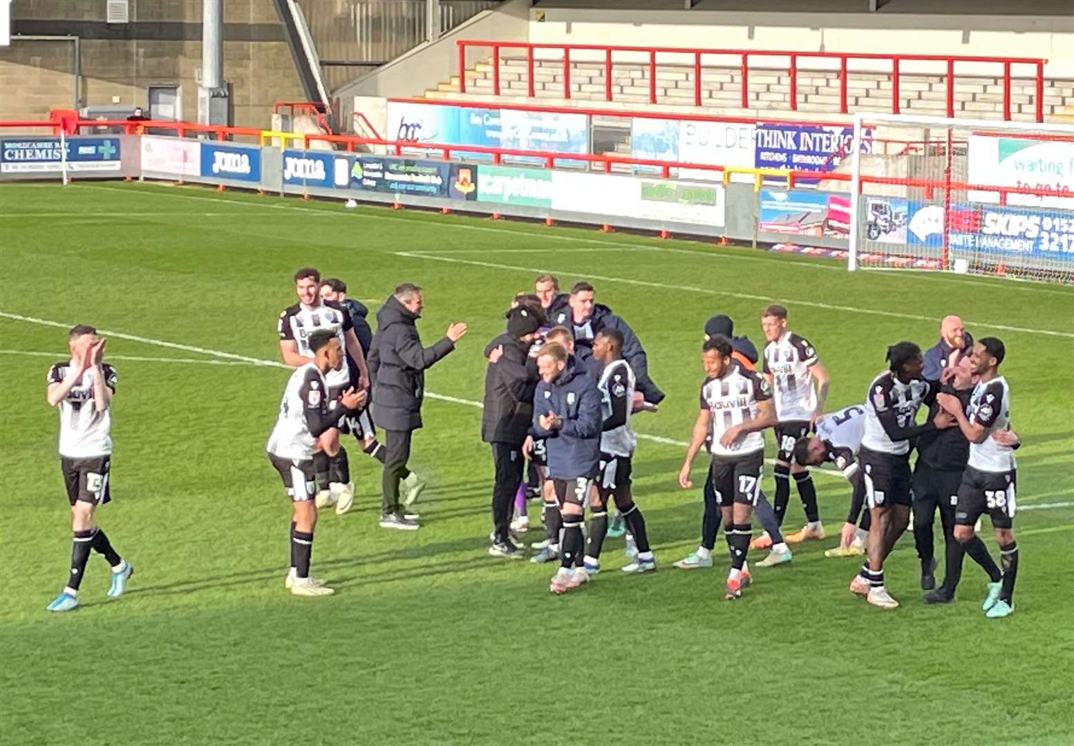 Gillingham celebrate their win at Morecambe