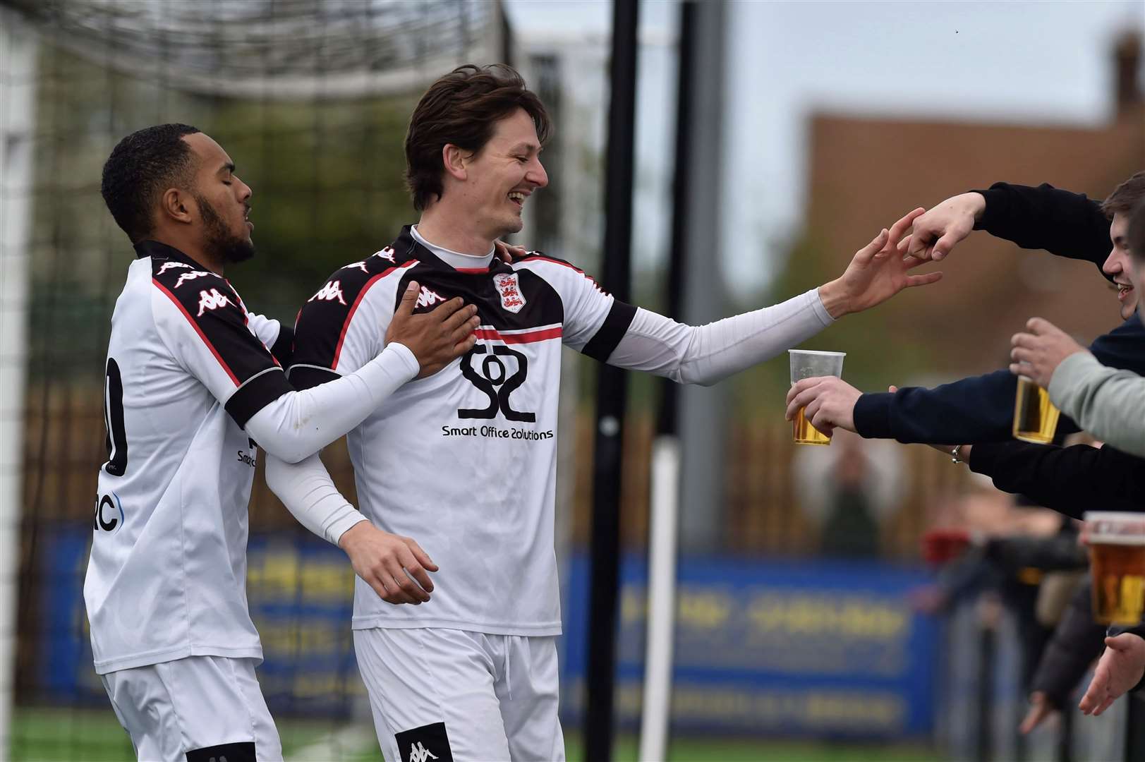 Billy Bennett celebrates with fans after putting Faversham in front against Welling Town. Picture: Ian Scammell