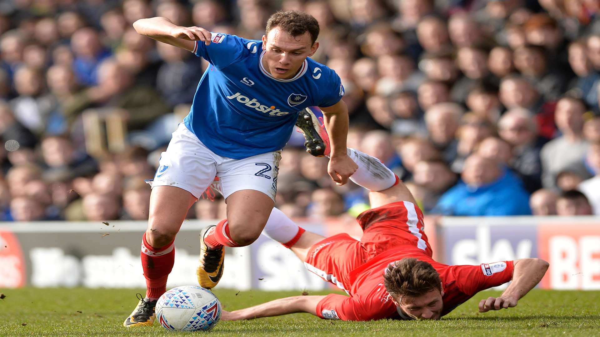 Luke O'Neill takes a tumble as Kal Naismith gets away Picture: Ady Kerry