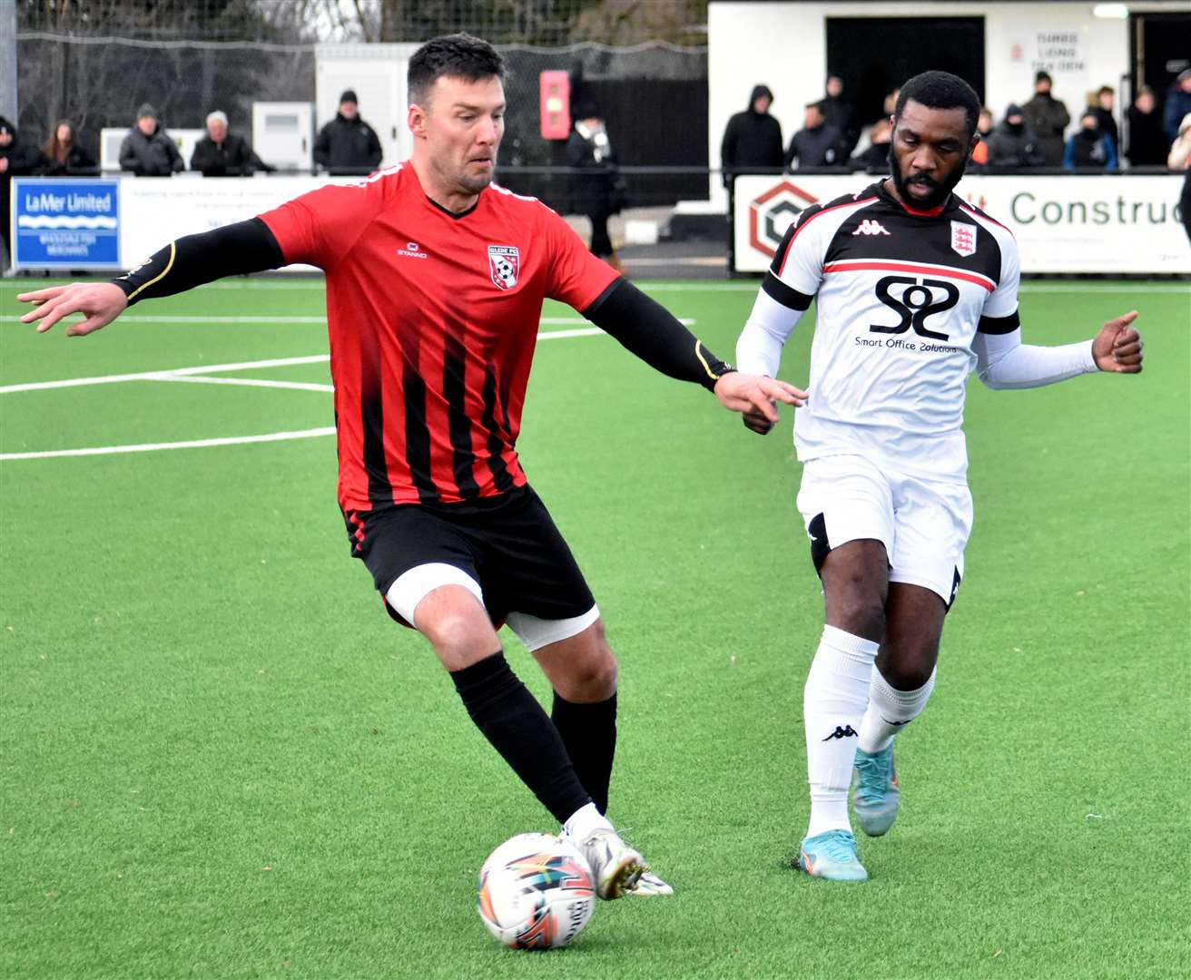 Glebe's veteran defender Jamie Coyle is closed down by Faversham frontman Warren Mfula. Picture: Randolph File