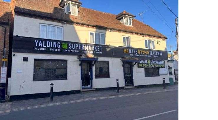 The former George pub in Yalding with the advertising hoarding that the council says was not sanctioned