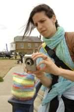 Abigail Hirsch stops to photograph a tea cosy on railings at Keam's Yard, part of the biennale