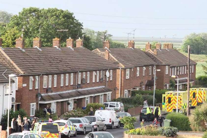 Emergency services at the scene of the stabbing in Fostall Road