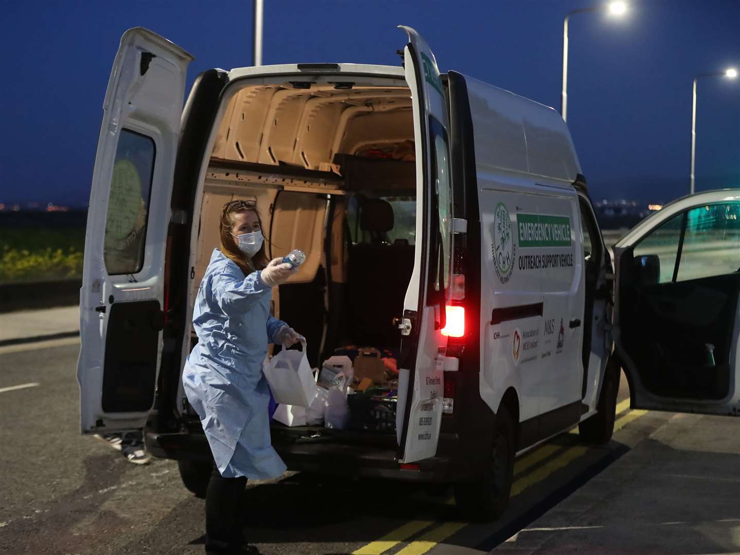 The volunteers wore protective equipment as they handed out hot drinks (Niall Carson/PA)