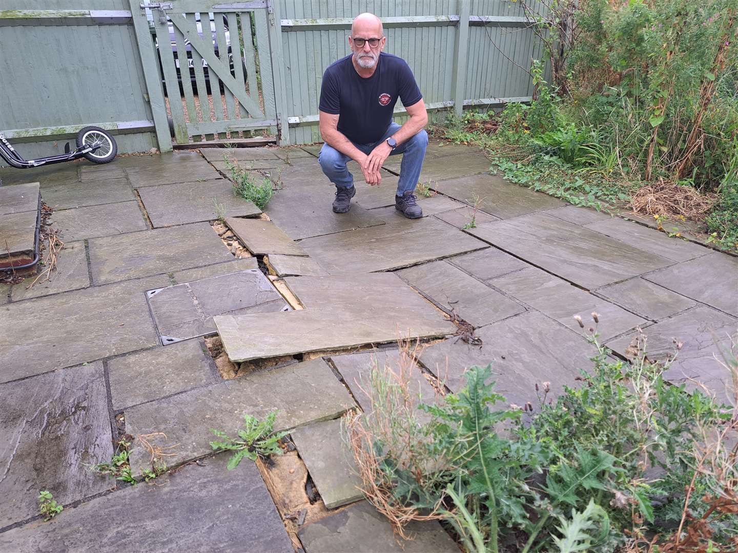 Steve Hann surveys his broken patio