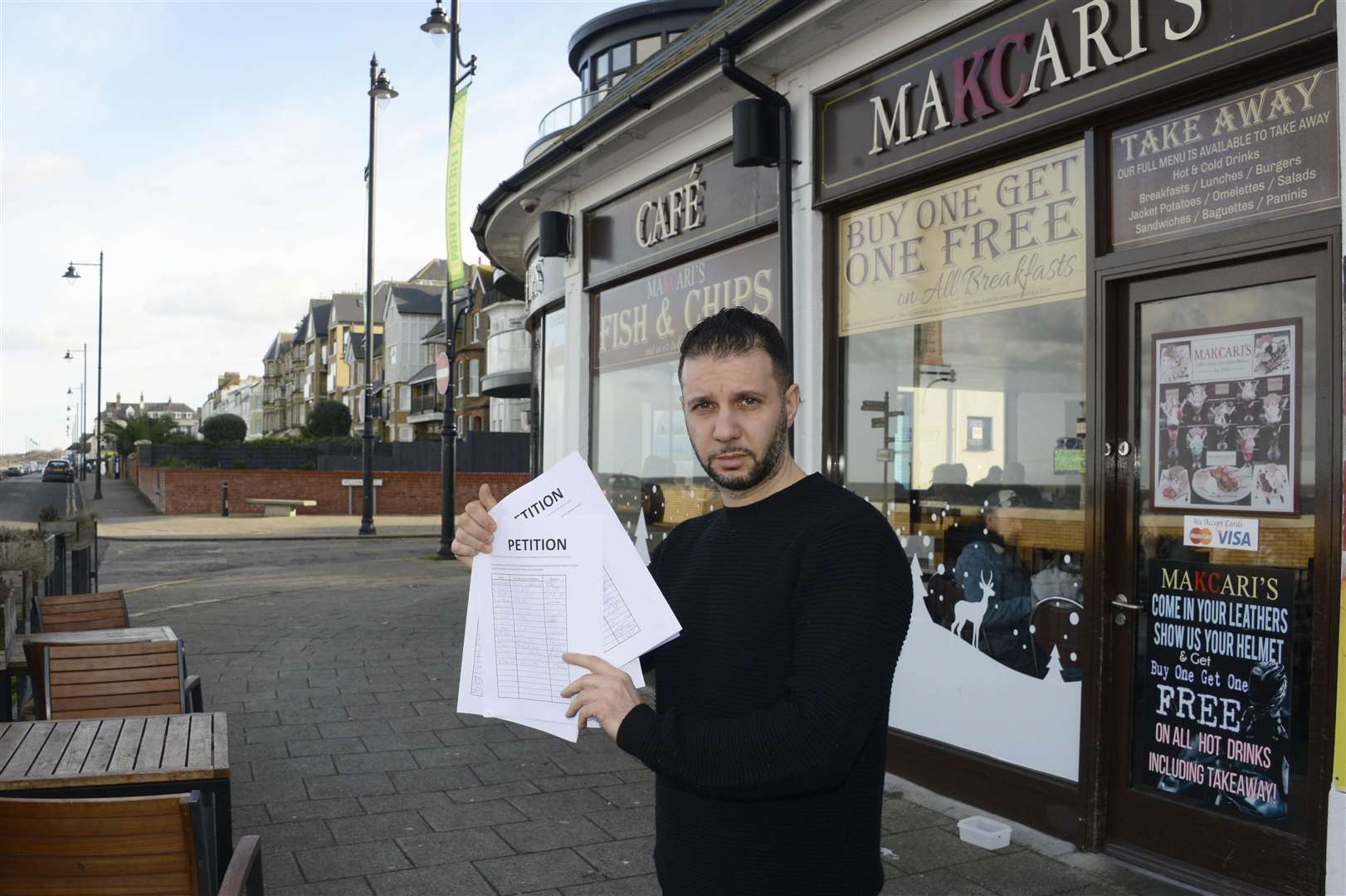 Hassan Hassan is fed-up with his cafe being flooded with people just coming in to use the toilets. Pictures: Paul Amos