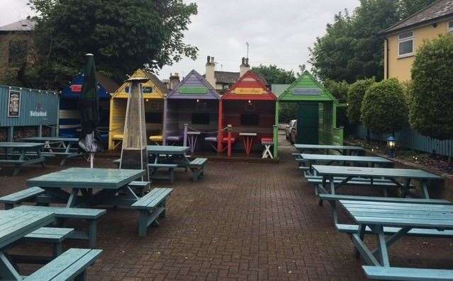 Sudden, heavy downpours of rain left the outside area at the back of Cramptons a no-go zone for the afternoon, though the beach hut-style shelters looked interesting