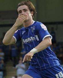 Luke Rooney celebrates after scoring from the spot