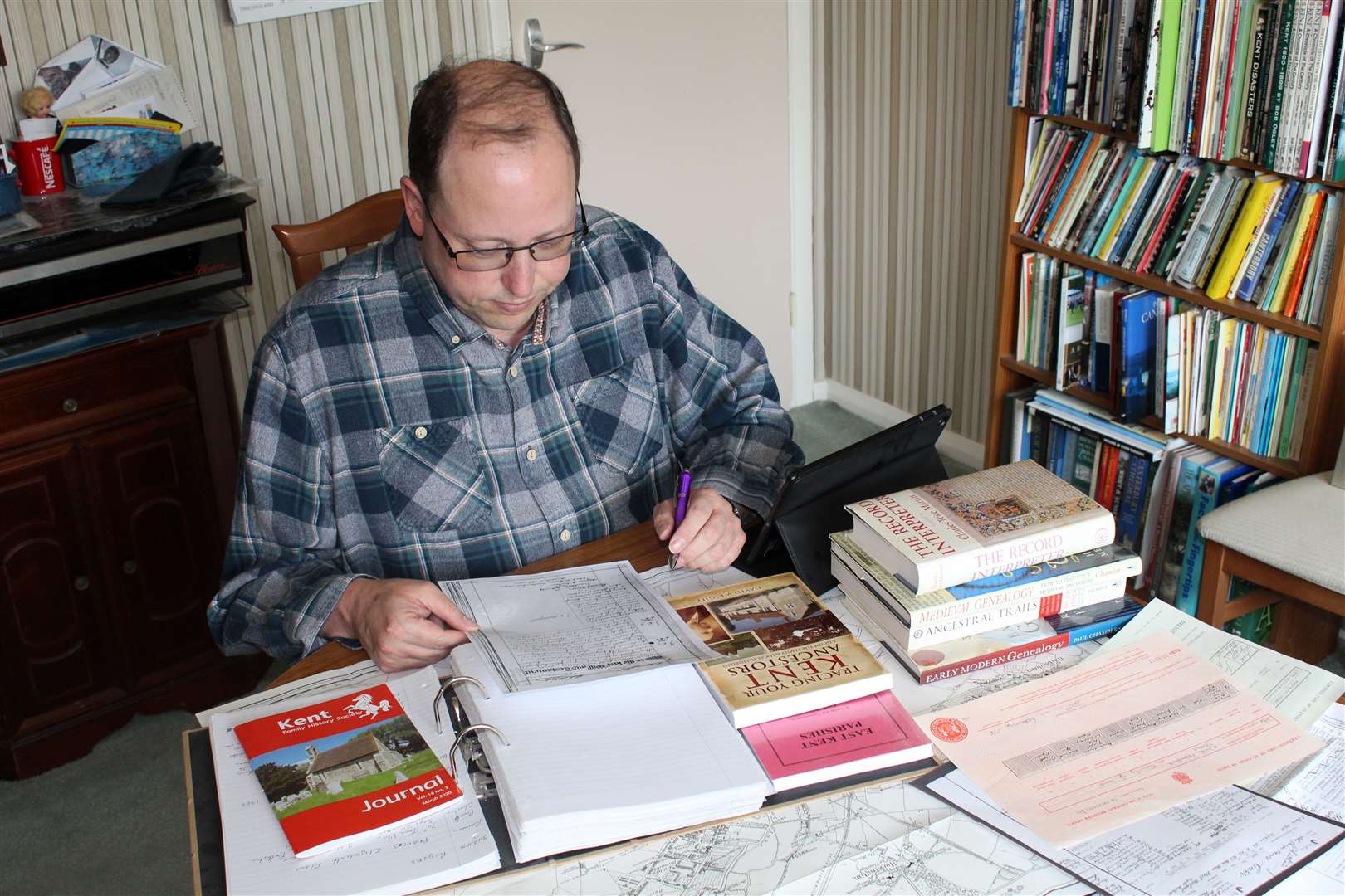 David Wood pours over some documents