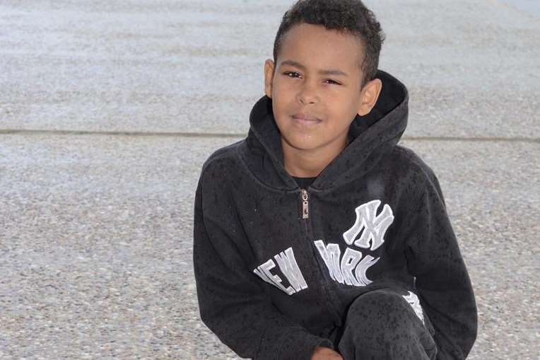 Mason Brooks on Dymchurch seafront with the ashes casket he found.