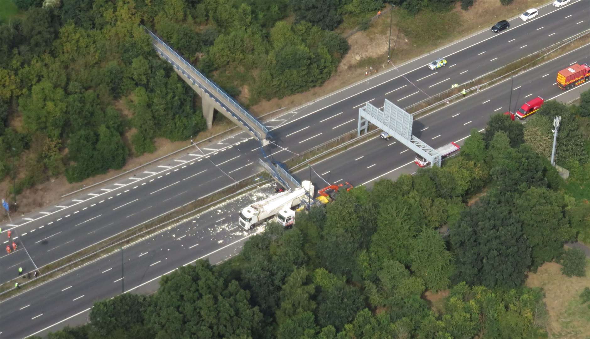 The scene after a lorry hit a bridge on the M20 in Maidstone in 2016. A motorcyclist was injured and the driver was prosecuted after carrying a load that was too high. Picture: Geoff Hall