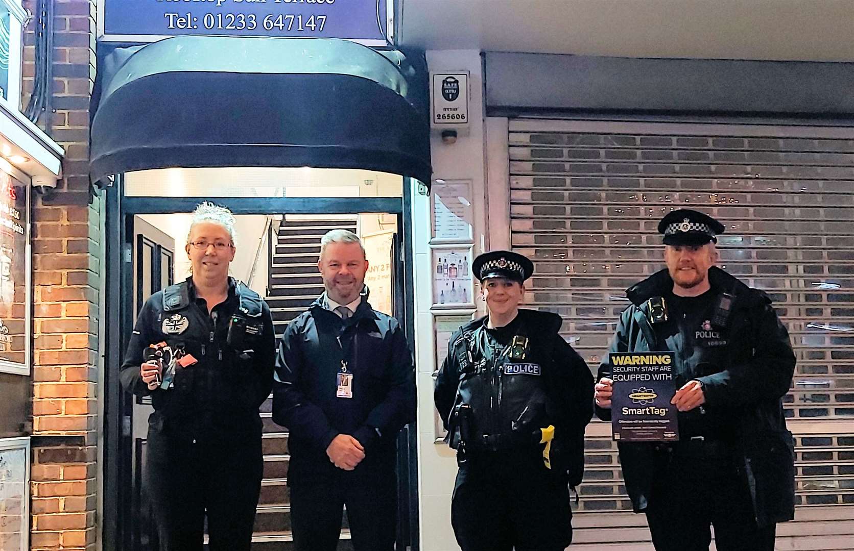 Kent Police Deputy Chief Officer Ian Drysdale (centre left), PC Danielle Butcher (centre right) and PC Alistair Pringle (right) presenting a SmartTag cannister to Ashford Club manager Jo Uden (left). Picture: Kent Police