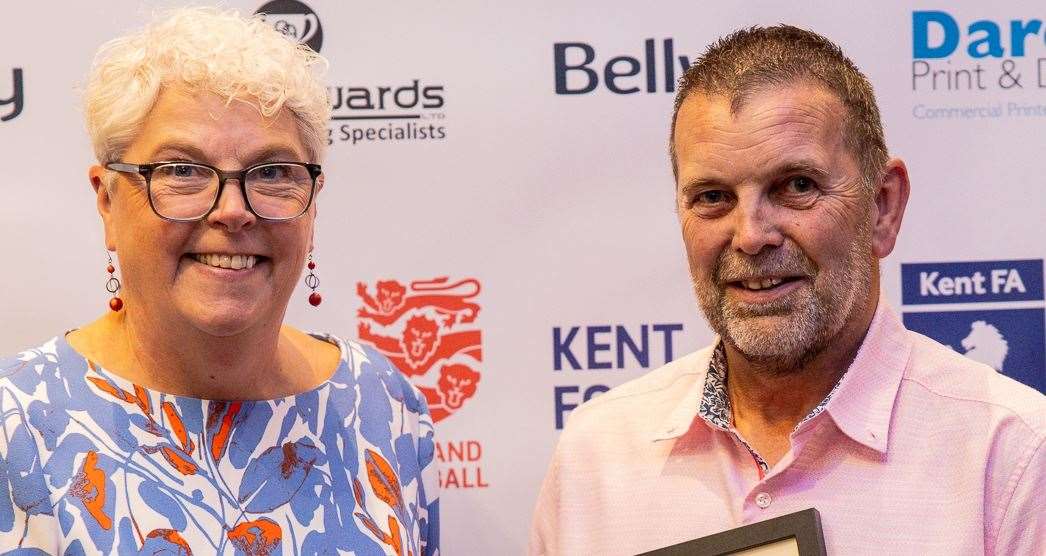 Barrie Croucher collects his award from Kent FA chair Denise Richmond. Picture: Kent FA