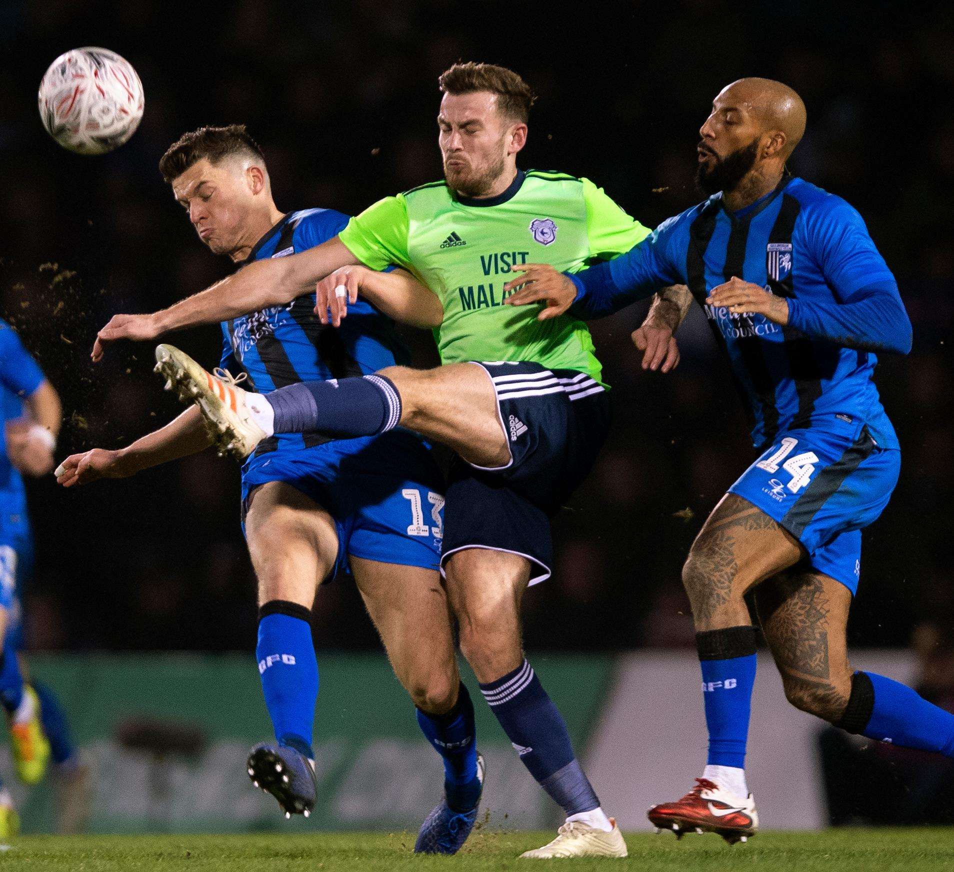 Callum Reilly and Josh Parker put Joe Ralls under pressure in midfield Picture: Ady Kerry