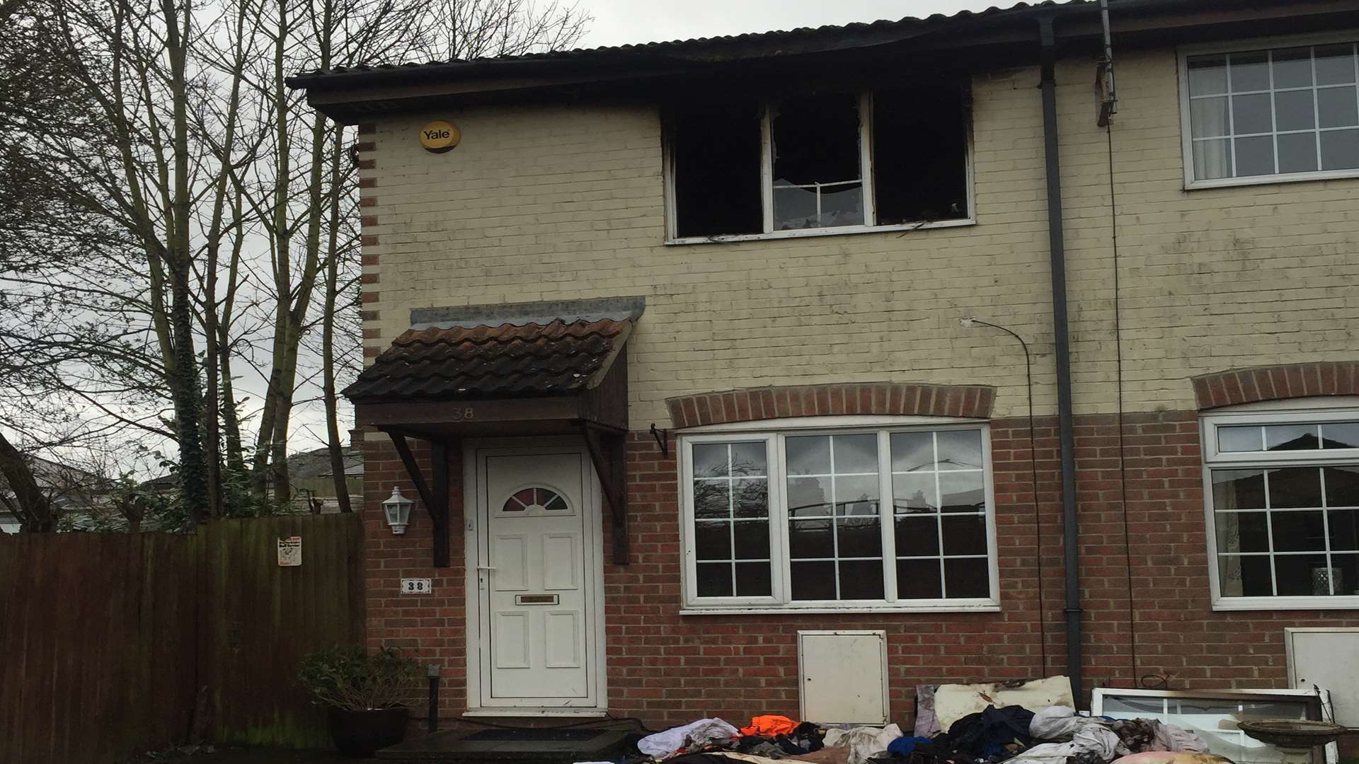 The charred window hints at the devastation inside