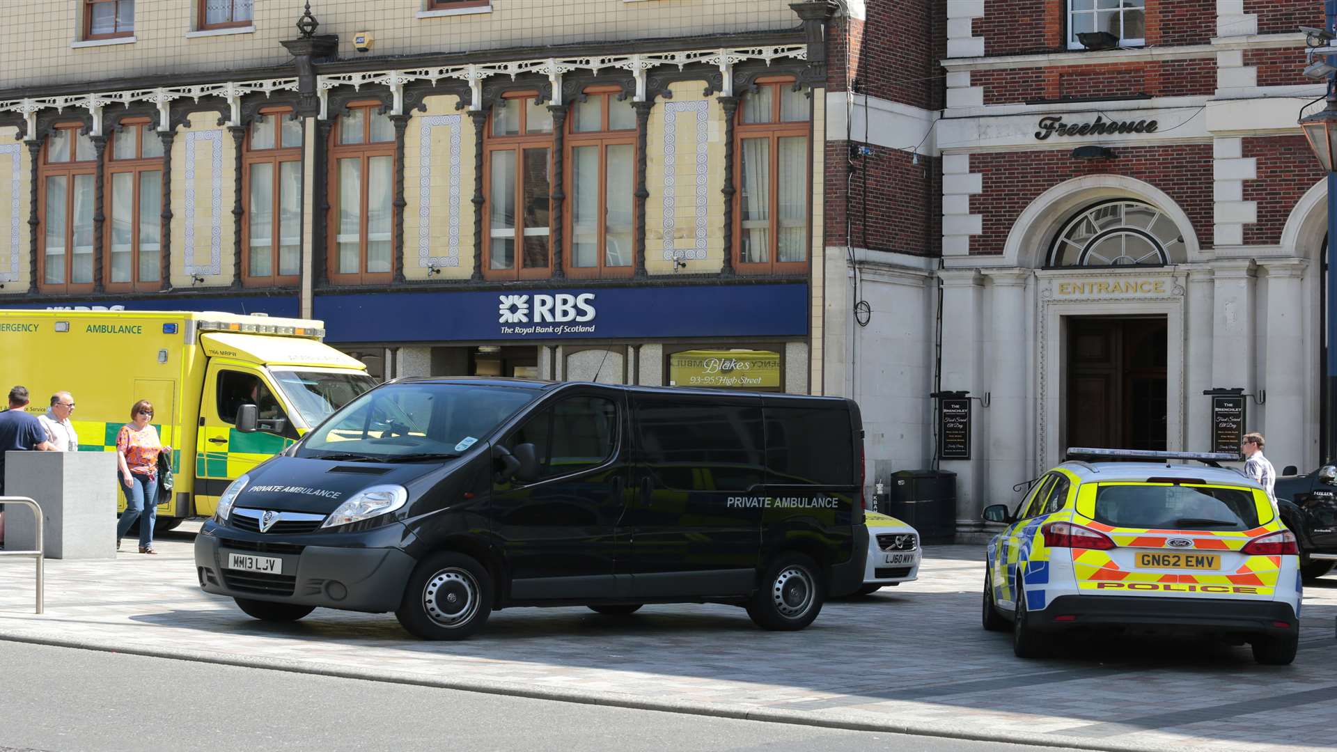 A private ambulance arrives outside the Town Hall