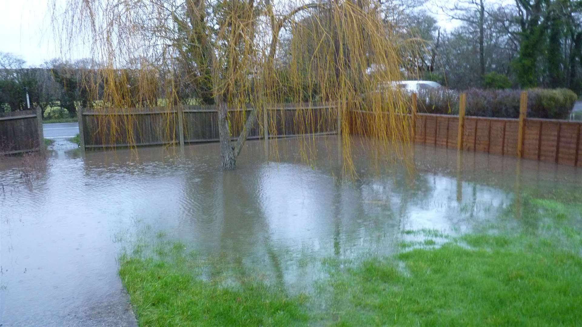 A drain next to the road is doing little to stop the flooding