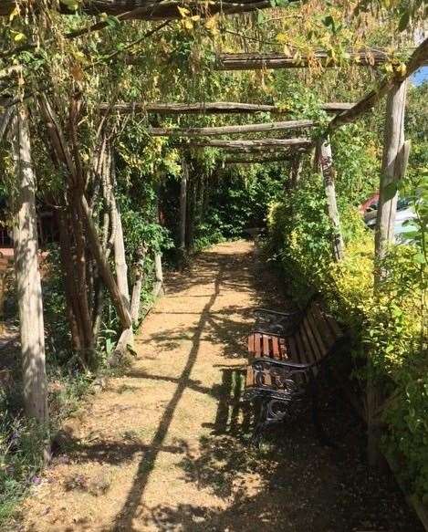 As you enter the garden the first thing you’ll see to your right is this traditional, partially-shaded arbour