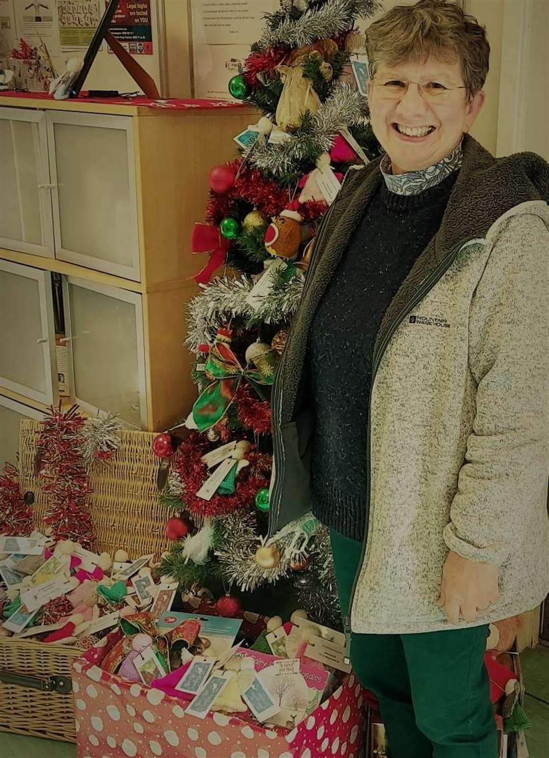 A member of the Tonbridge Road Methodist Church drops off donated items (43841659)