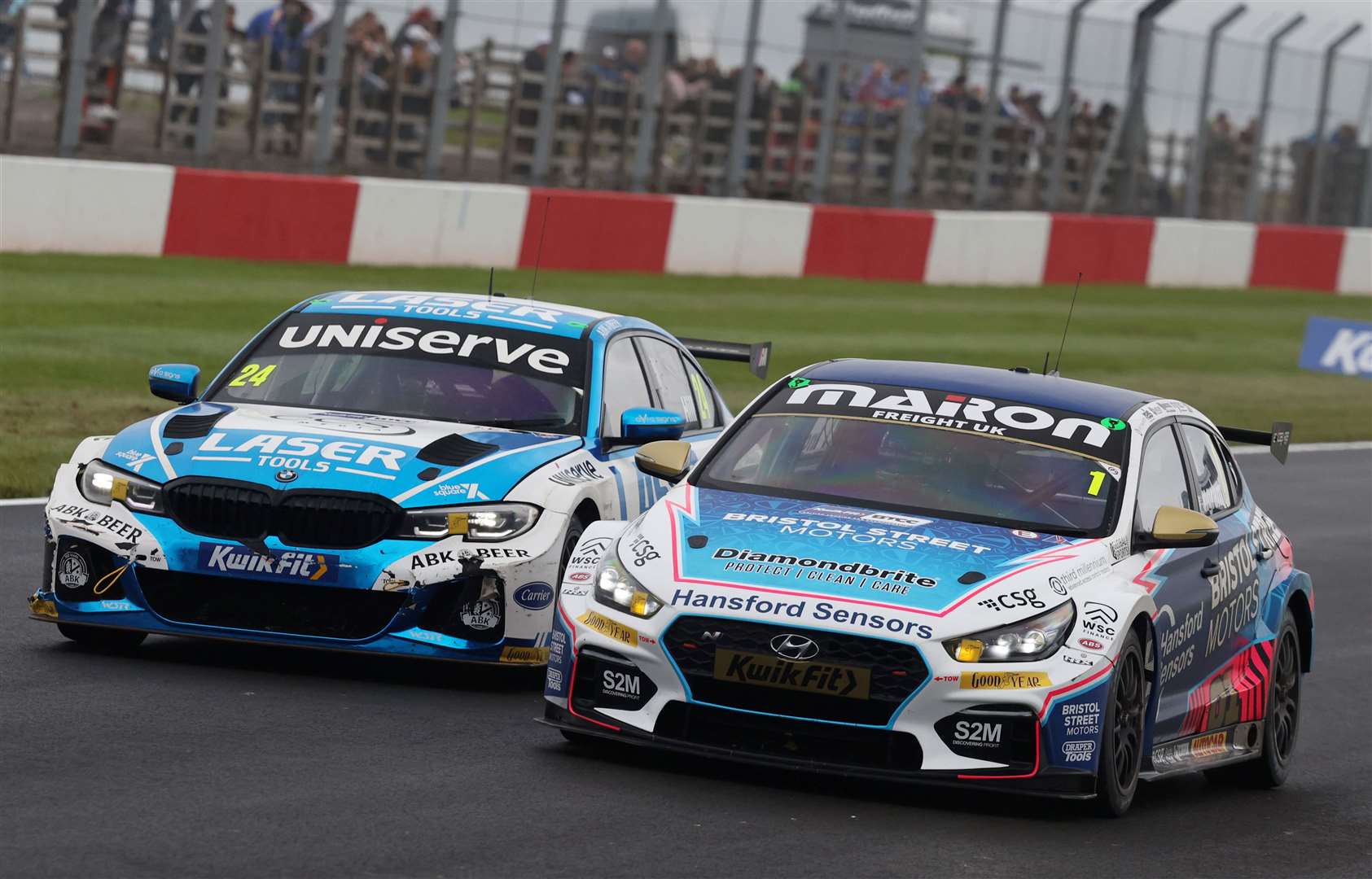 Jake Hill, left, battles Tom Ingram at Donington Park. Picture: BTCC