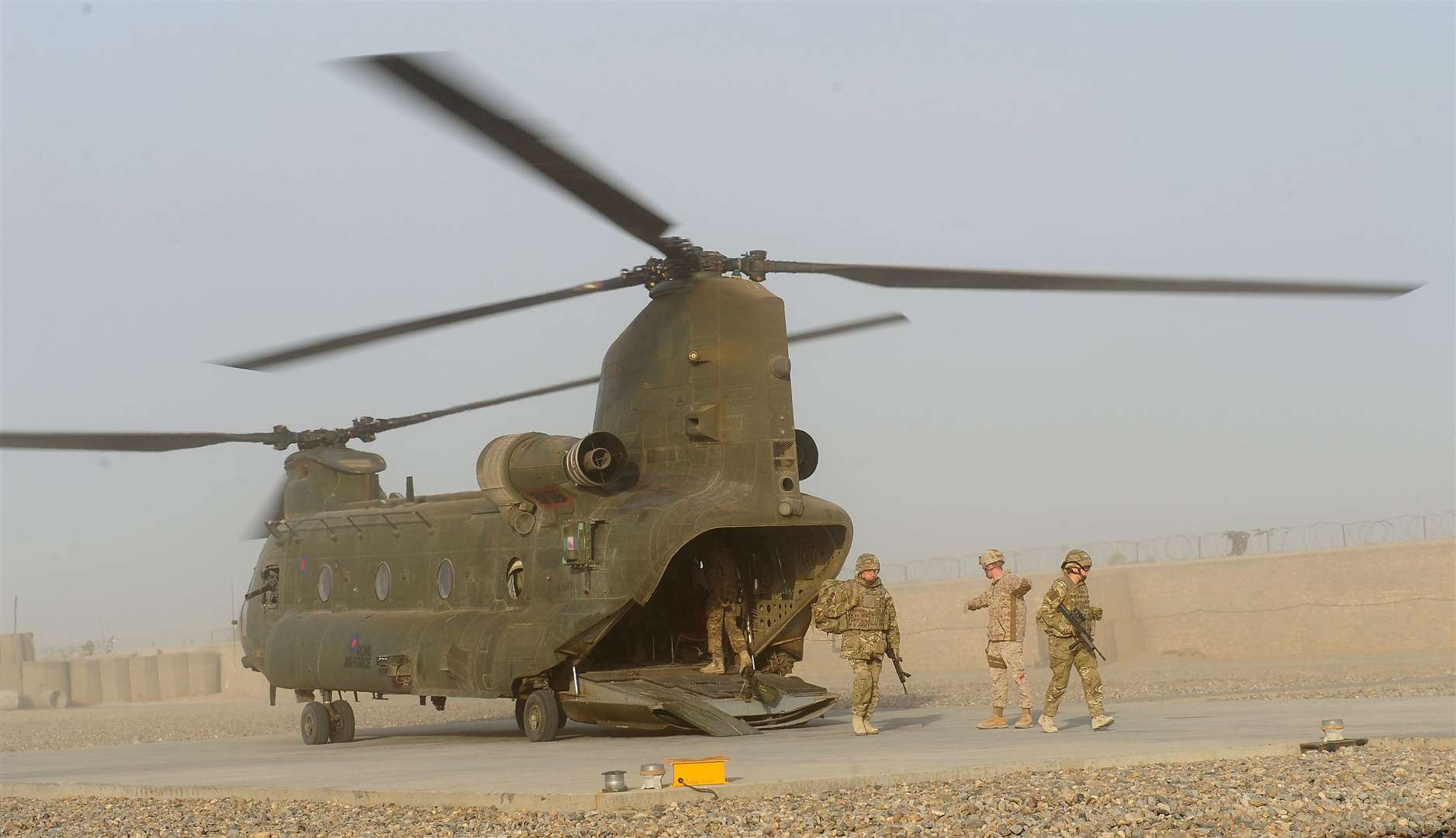 The oldest Chinook helicopters will be accelerated out of service (Owen Humphreys/PA)