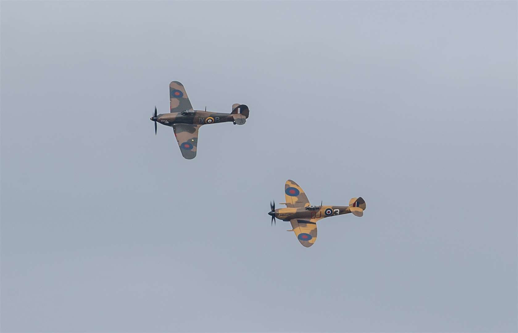 A Battle of Britain Memorial Flight flypast of a Spitfire and a Hurricane passes over the home of Second World War veteran Captain Tom Moore (Joe Giddens/PA)