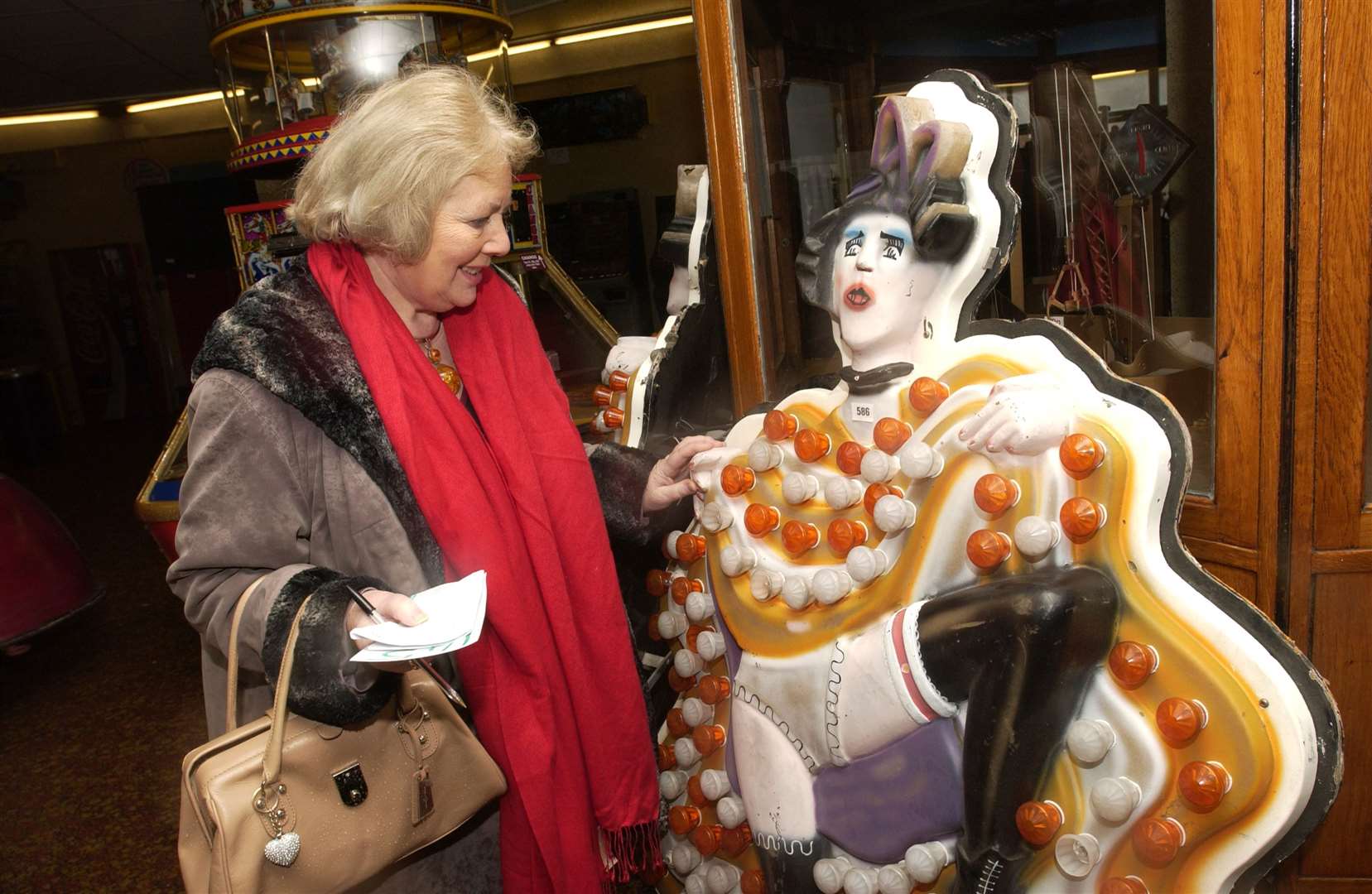 2007 - Folkestone Rotunda's auction to sell off the remnants of the fair and arcade. Pictured: Angela Chilton views some of the lighting