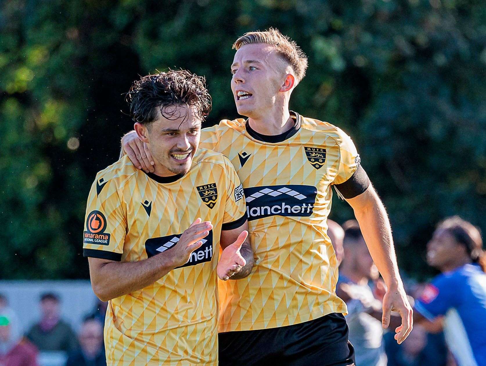 Maidstone’s players celebrate their goal - an own goal - in their 1-0 FA Cup third qualifying round victory at Herne Bay on Saturday. Picture: Helen Cooper