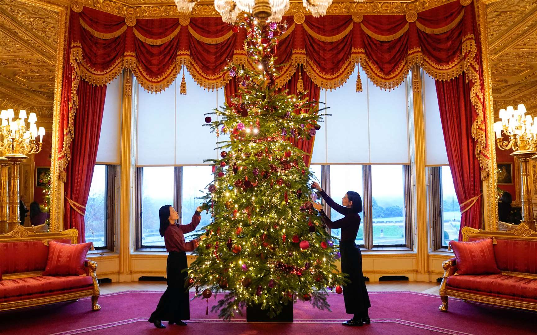 Another Christmas tree in the Crimson Drawing Room (Andrew Matthews/PA)