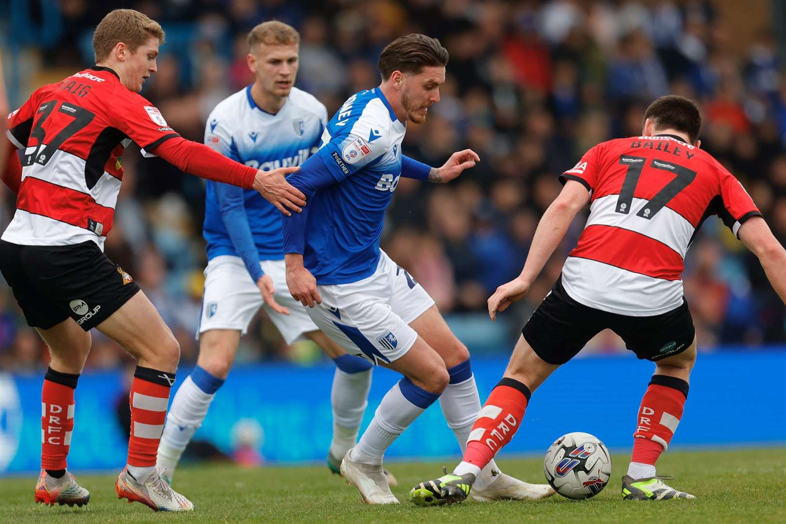 Gillingham's Connor Mahoney takes on Owen Bailey Picture: Beau Goodwin