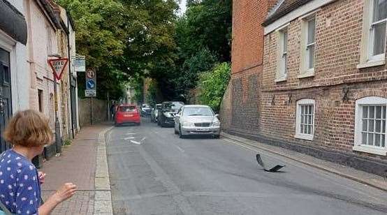 Broken bodywork in the middle of the road after the crash