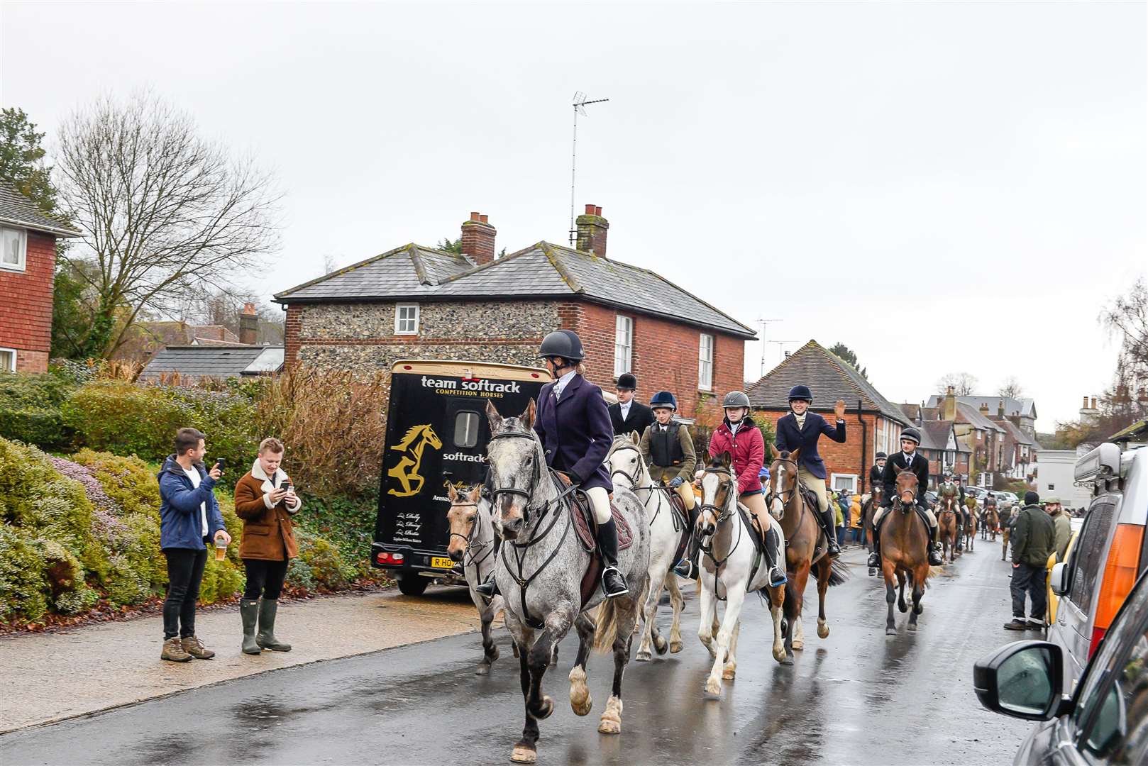 The hunt setting off through Elham village square