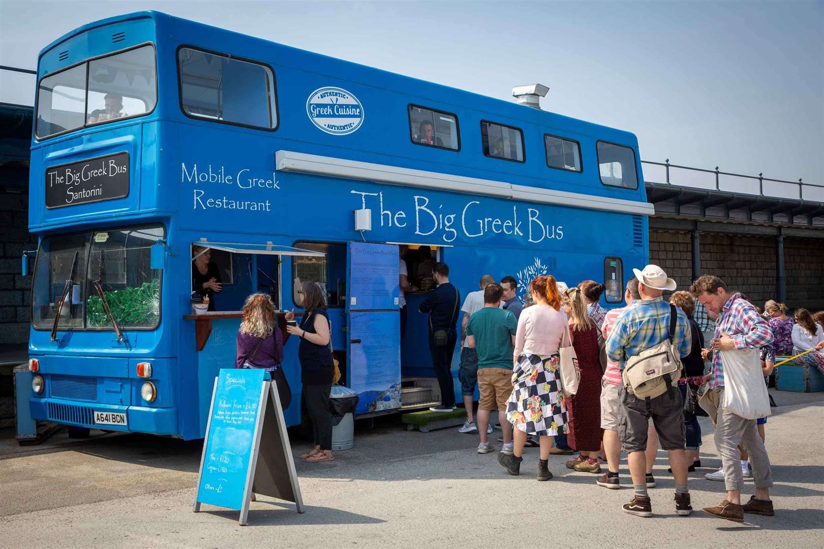 The Big Greek bus was towed away from Folkestone Harbour Arm in February. Picture: Folkestone Harbour Arm