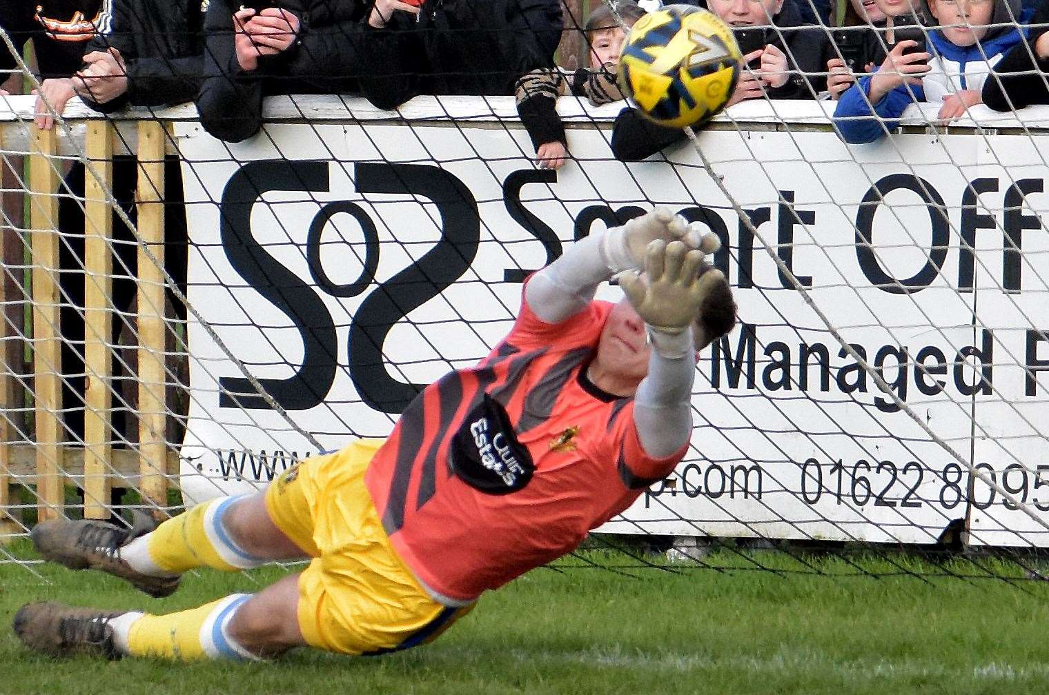 Stand-in keeper Harrison Pont saves Adebayo Akinfenwa's last-gasp penalty in Sittingbourne's 1-0 weekend win at Faversham. Picture: Randolph File