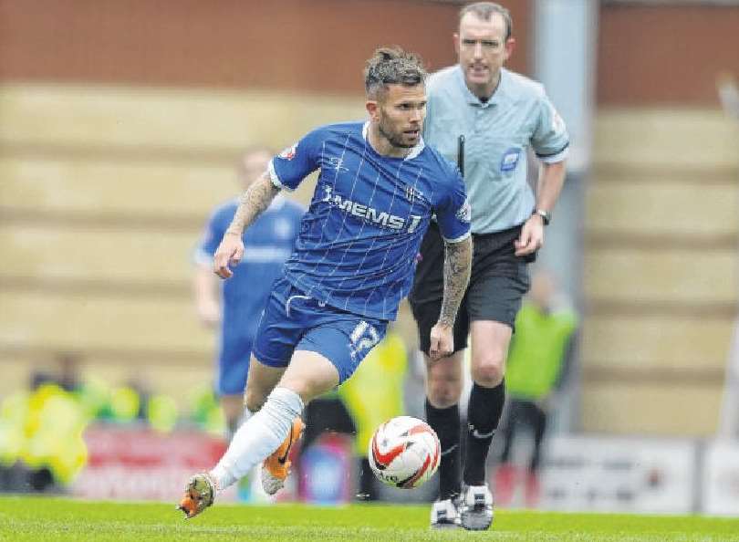 Adam Birchall in action for Gillingham last season against Leyton Orient