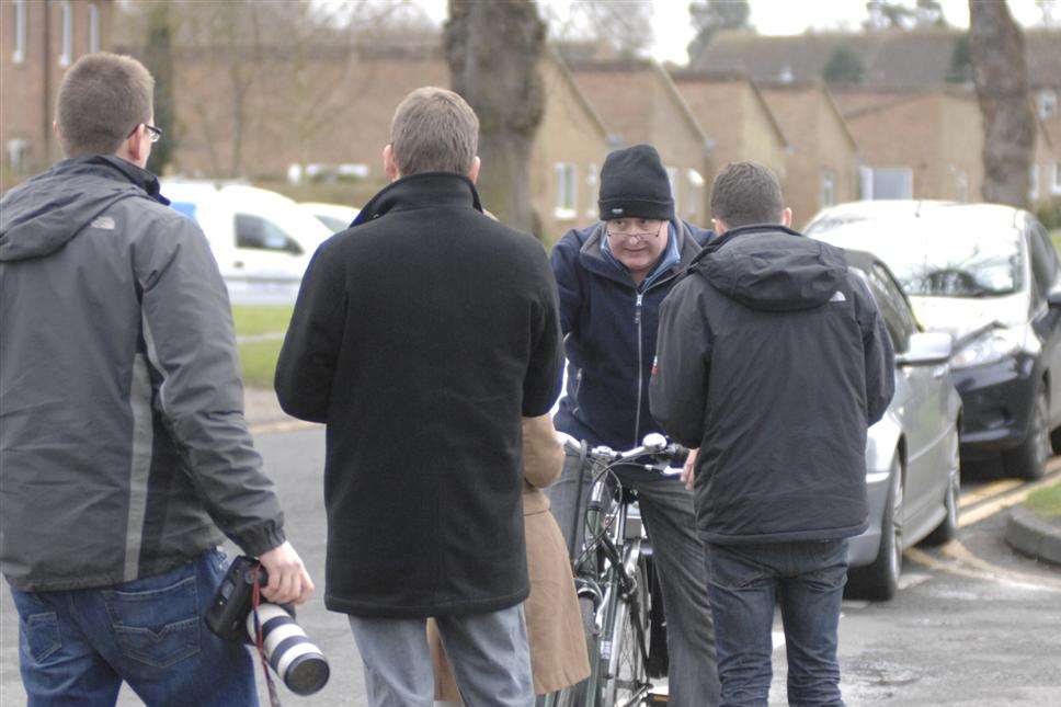 Bolinger is surrounded by the media after his arrest