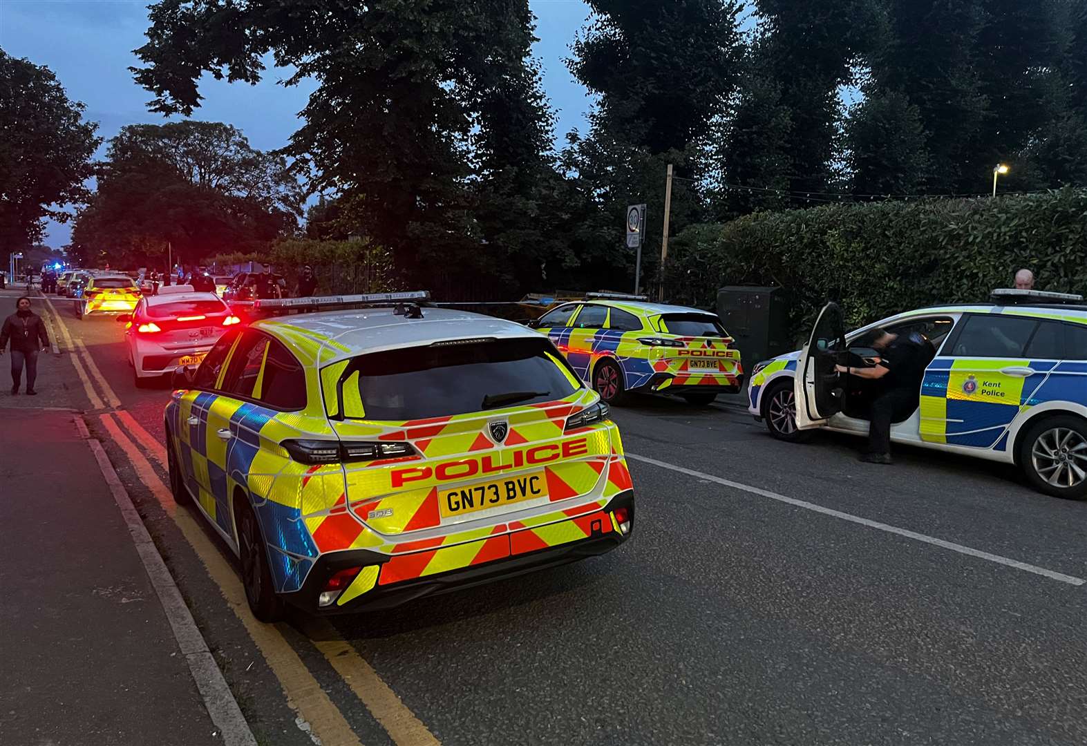 Police cars line the street in Gravesend on the road leading to the gurdwara on the evening of the attack