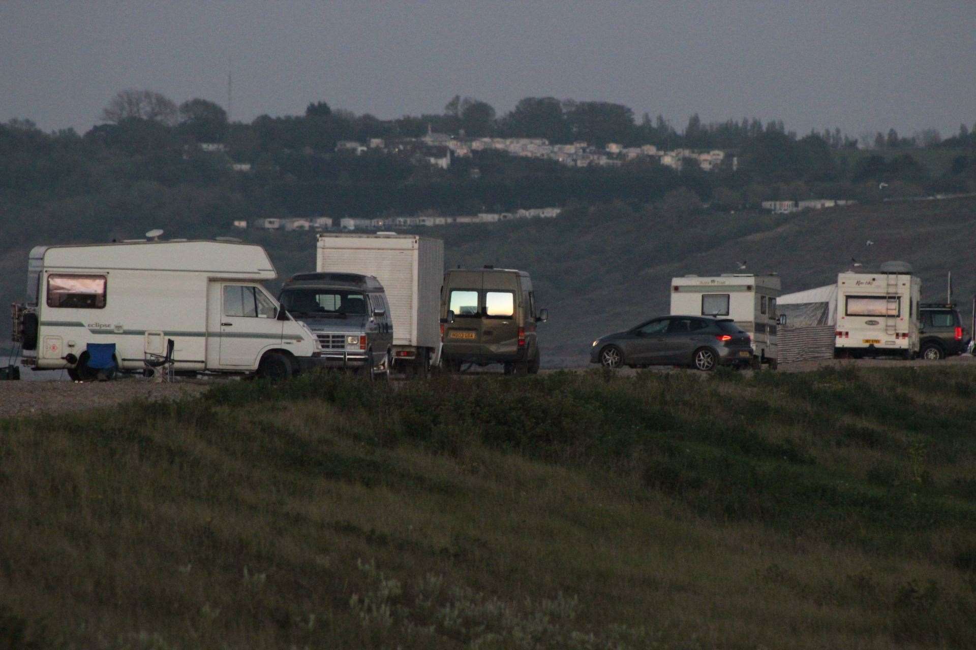 Motorhomes on the shingle bank at Sheerness on the Isle of Sheppey. Stock picture