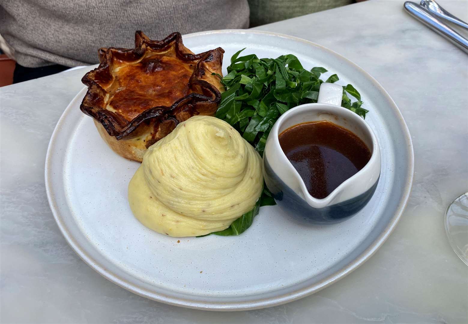 Chicken and ham hock pie (£22) was served with a grain mustard mash potato and spring greens