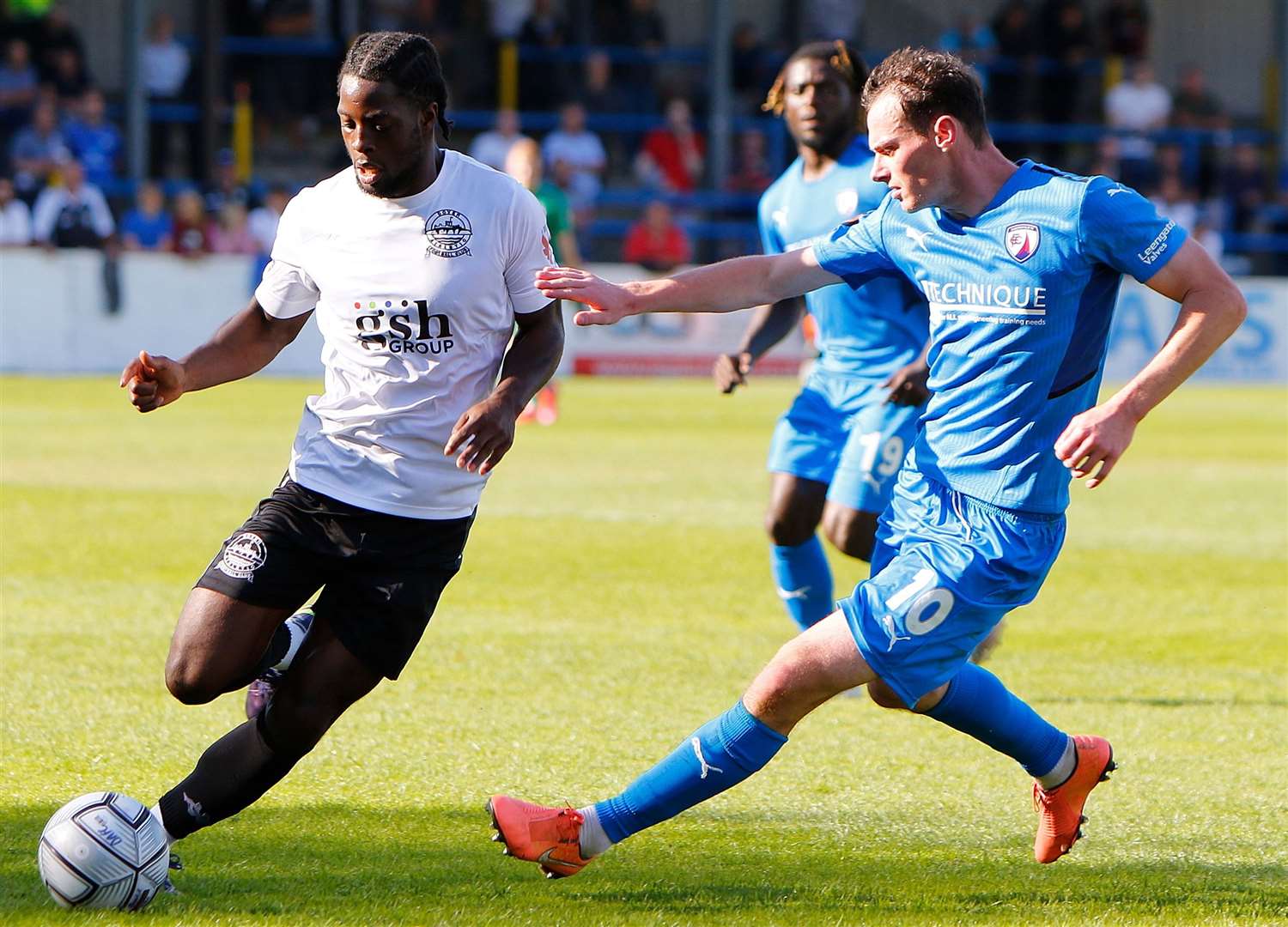 Dover's Travis Gregory is tracked by Chesterfield's Liam Mandeville. Picture: Andy Jones (51128256)