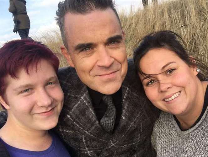 Dan Hughes and Sasha Burgoine with Robbie Williams in Leysdown in 2016