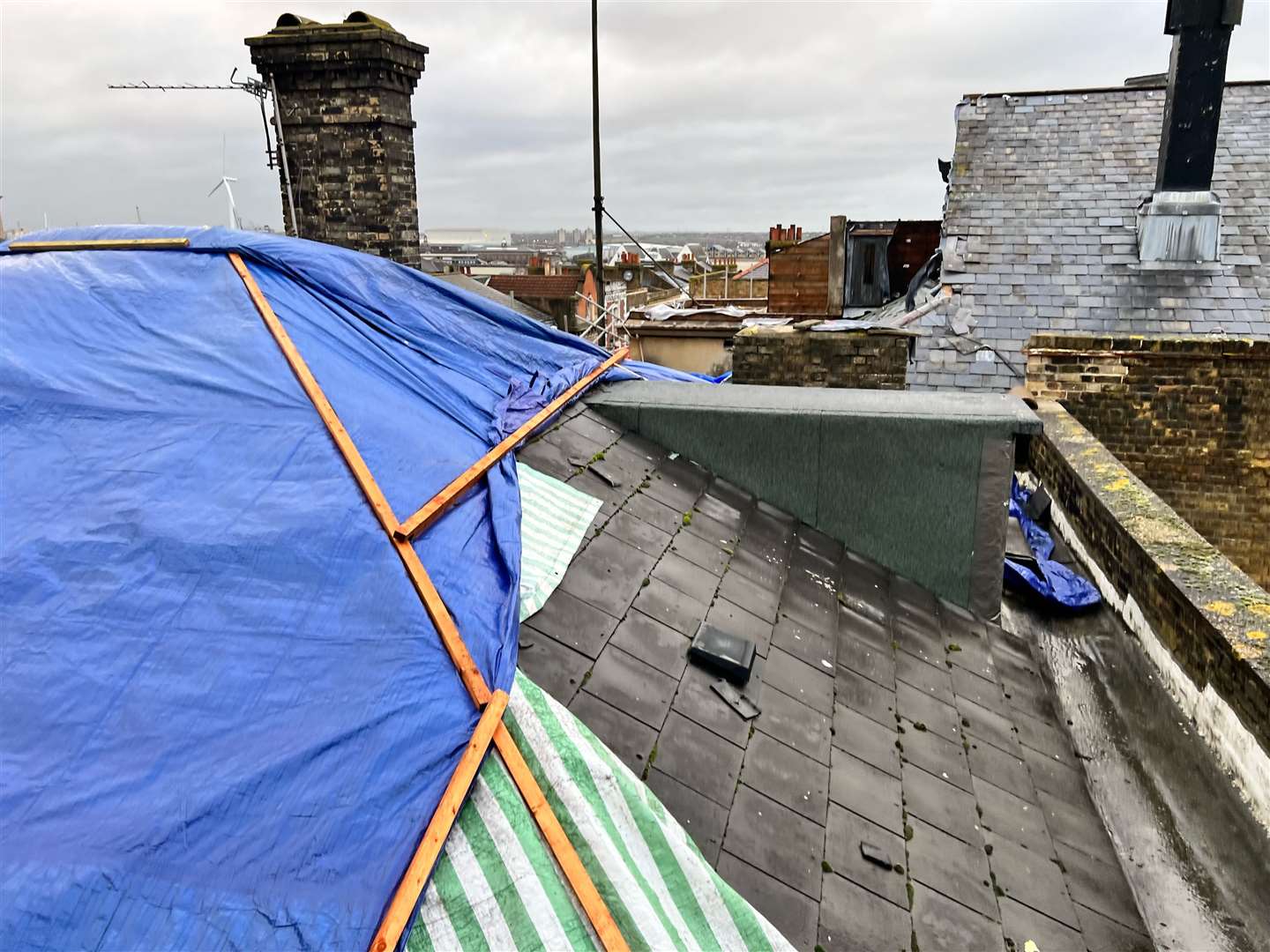 Tarpaulin has been put across the building to prevent further damage. Picture: Ejaz Aslam