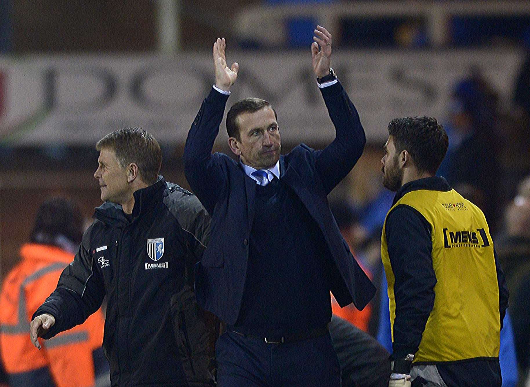 Justin Edinburgh thanks the away fans at Peterborough Picture: Barry Goodwin