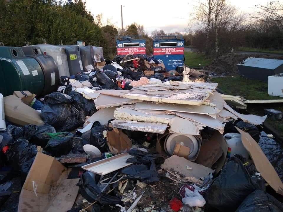 Fly-tipped waste at a bottle bank near Birchwood golf course near Dartford