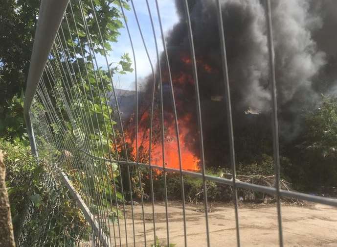 Firefighters tackled an out of control bonfire in Crown Quay Lane, Sittingbourne this morning. Picture: Martin Phillips