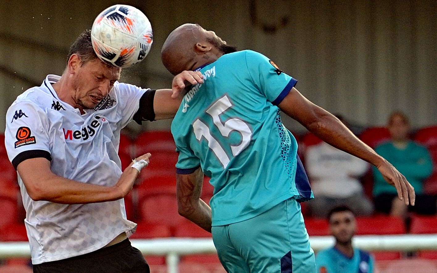 A patched-up Jake Goodman, left, wins a header in Dover's 3-1 victory on Saturday over Braintree. Picture: Stuart Brock