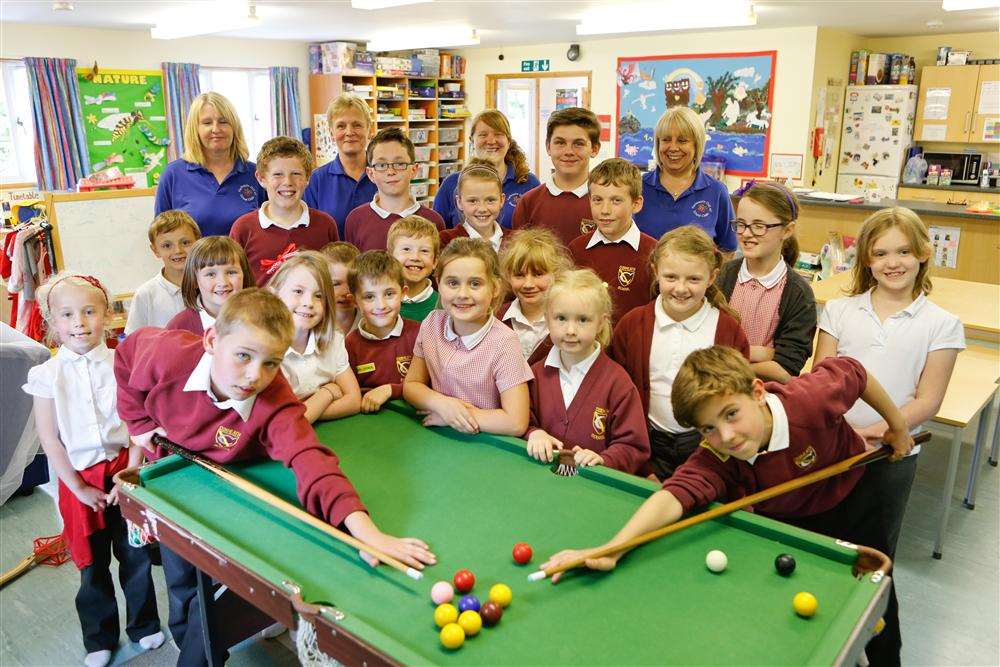 Harlequin Out of School Club receives an Outstanding Ofsted report. Youngsters with staff Alison Payne, Melanie Harrison, Rachel Garrett and Susan Lambert.